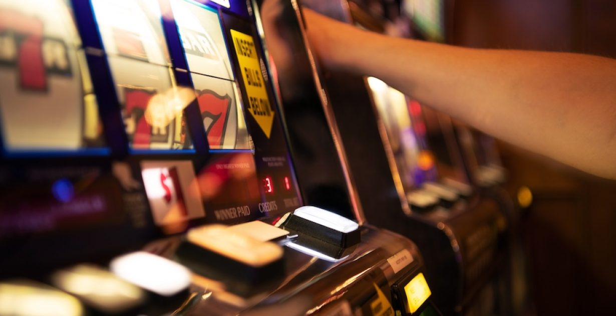 Vegas Style Classic One Handed Bandit Casino Slot Machine Game Close Up. Gambling Industry Theme.